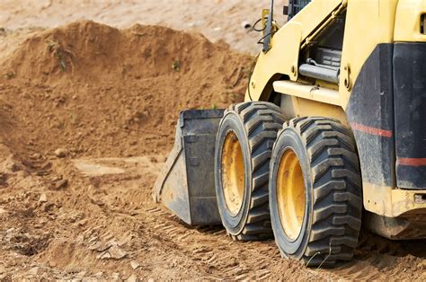 using skid steer to clear land|heavy brush clearing equipment.